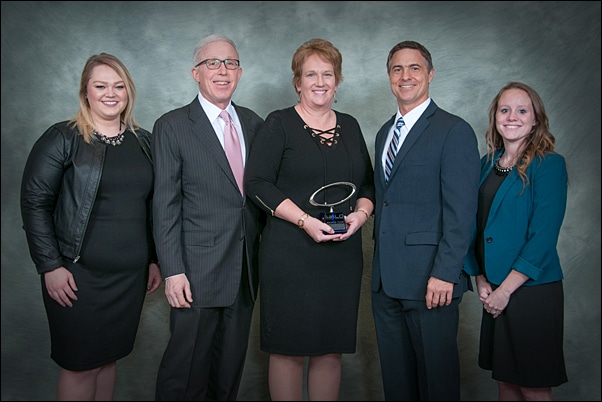 Pattry Ceranski, Gemline major accounts representative (center), stands with her Supplier Representative Of The Year award and (from left) Natalie Ehredt, supplier relations, HALO; Marc Simon, CEO, HALO; Terry McGuire, senior vice president of marketing and supplier relations, HALO; and Amanda Schreck, supplier relations, HALO.