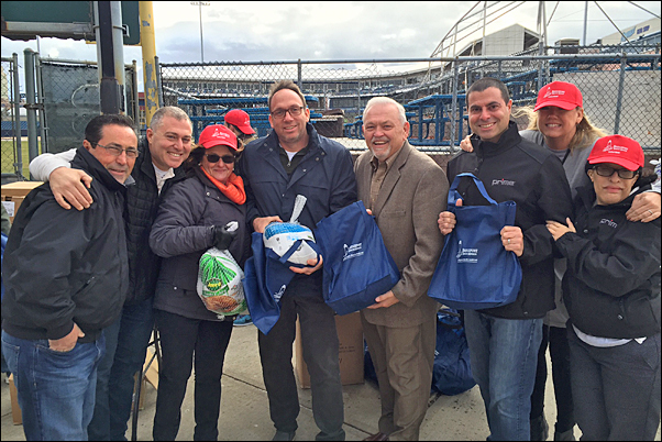 Prime Line CEO Jeff Lederer (center left) and staff members join Bridgeport Rescue Mission Executive Director Terry Wilcox (center right) at the BRM's Great Thanksgiving Project.