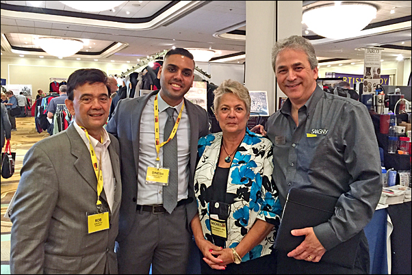 Mike Schenker, MAS (right) introduces Michelle Jennrich,MAS, to (from left) Rob Pettet, district director for Rep. Scott Garrett, and Dinesh Suryawanshi, a projects specialist for Sen. Cory Booker, on the SAAGNY Fall Showcase show floor.