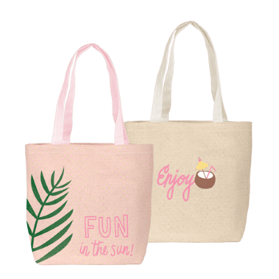 pink straw tote bag and natural tan straw tote bag, both with printed designs
