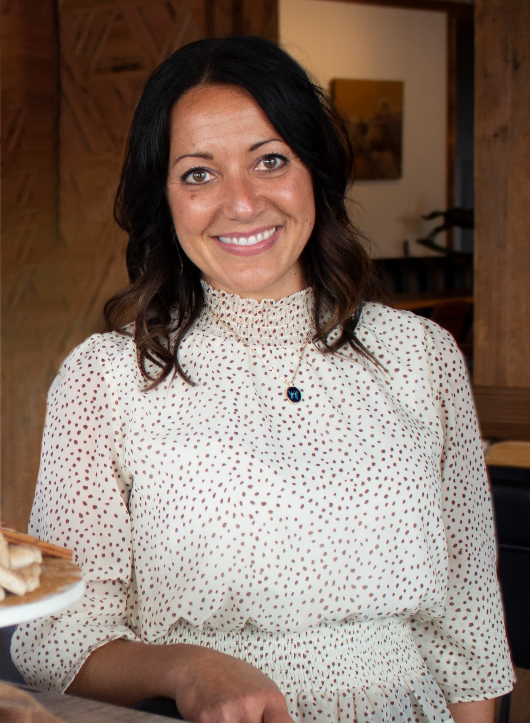 Jodie Schillinger (Maple Ridge Farms) - smiling woman with long dark hair wearing a white blouse